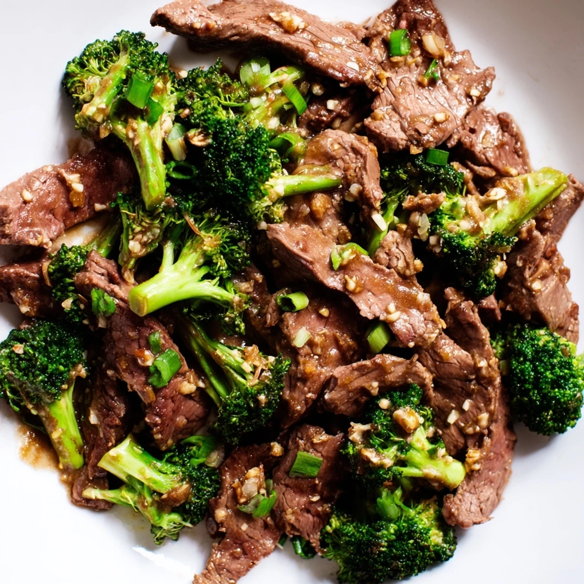 Steaming Keto Friendly Beef and Broccoli Stir Fry with tender beef and bright green broccoli coated in savory garlic-ginger sauce.