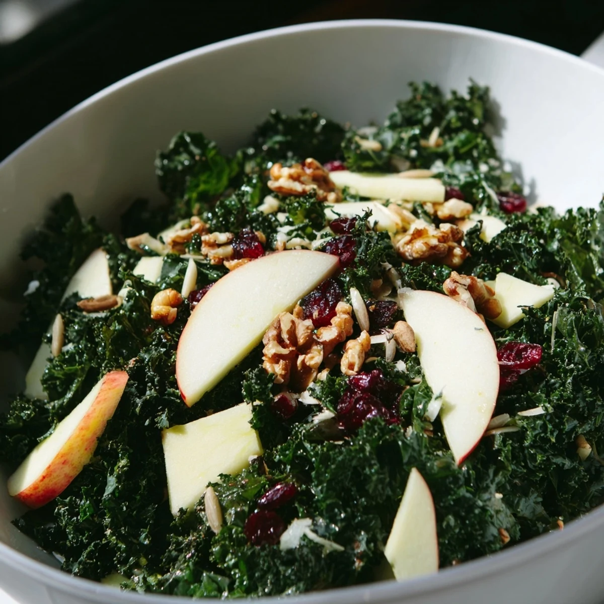 Massaged kale salad with apple and sharp cheddar topped with toasted walnuts and zesty apple cider dressing.