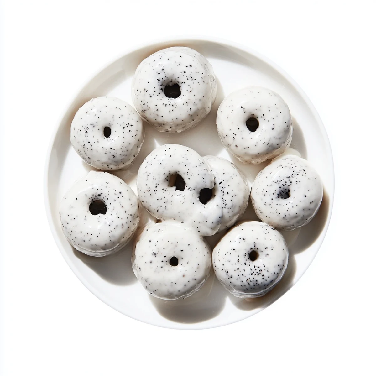 The Black Sesame Mochi Donuts feature a crackly glaze and a side view revealing the dense, gluten-free mochi interior.