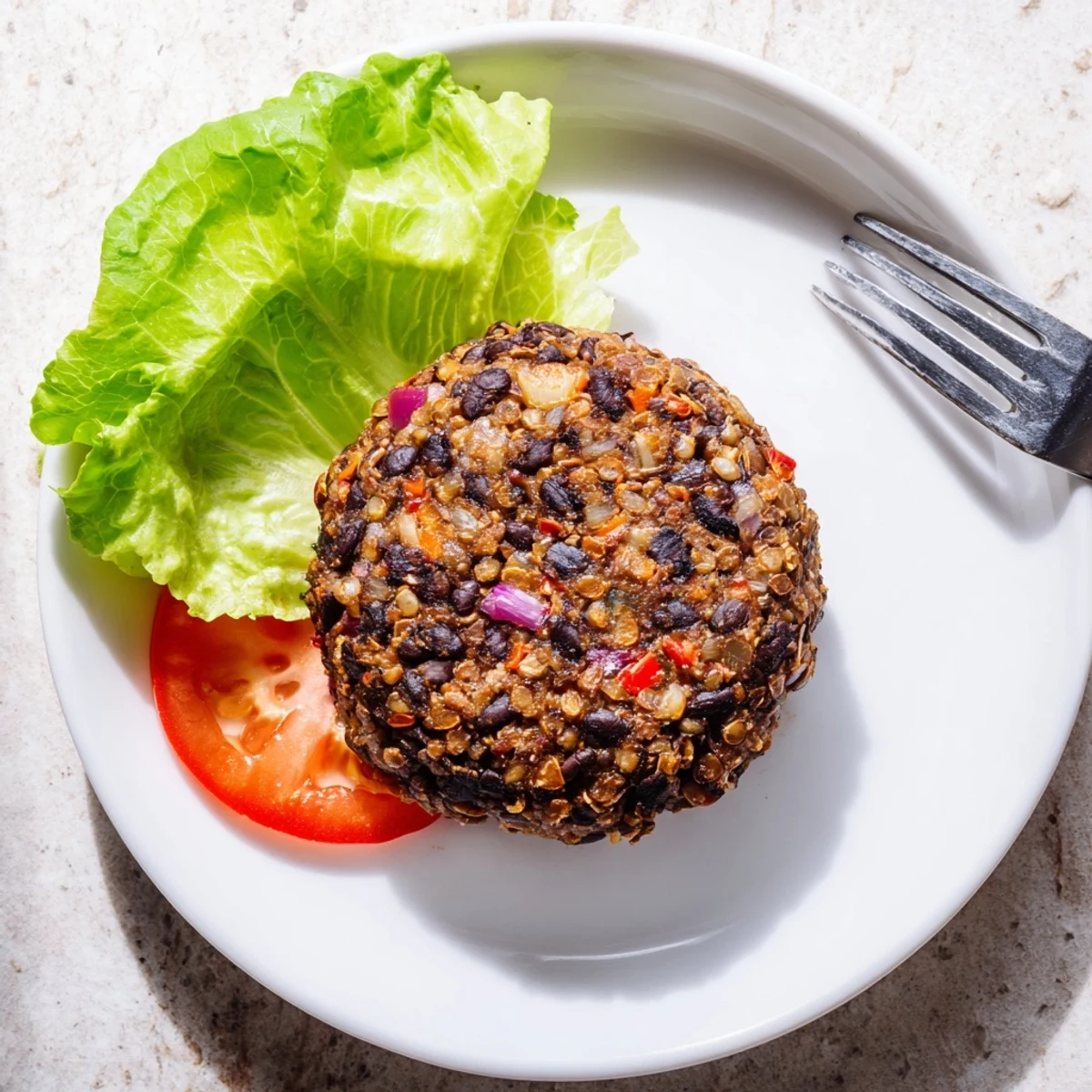 Golden-brown mushroom veggie burgers sizzling in a skillet with sautéed onions and garlic for a hearty American dinner.