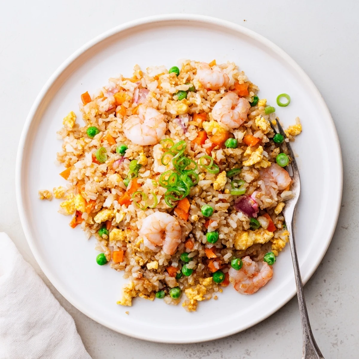 Wok-fried authentic shrimp fried rice with plump pink shrimp and fluffy seasoned jasmine rice grains