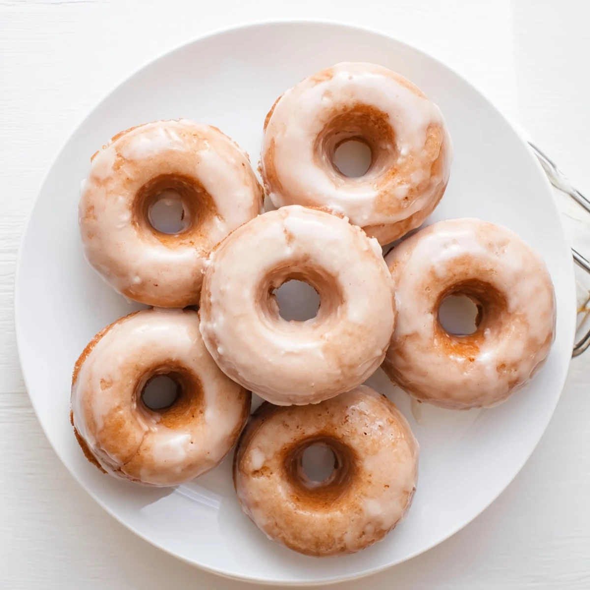 Soft chewy maple pumpkin mochi donuts topped with dripping white maple icing glaze