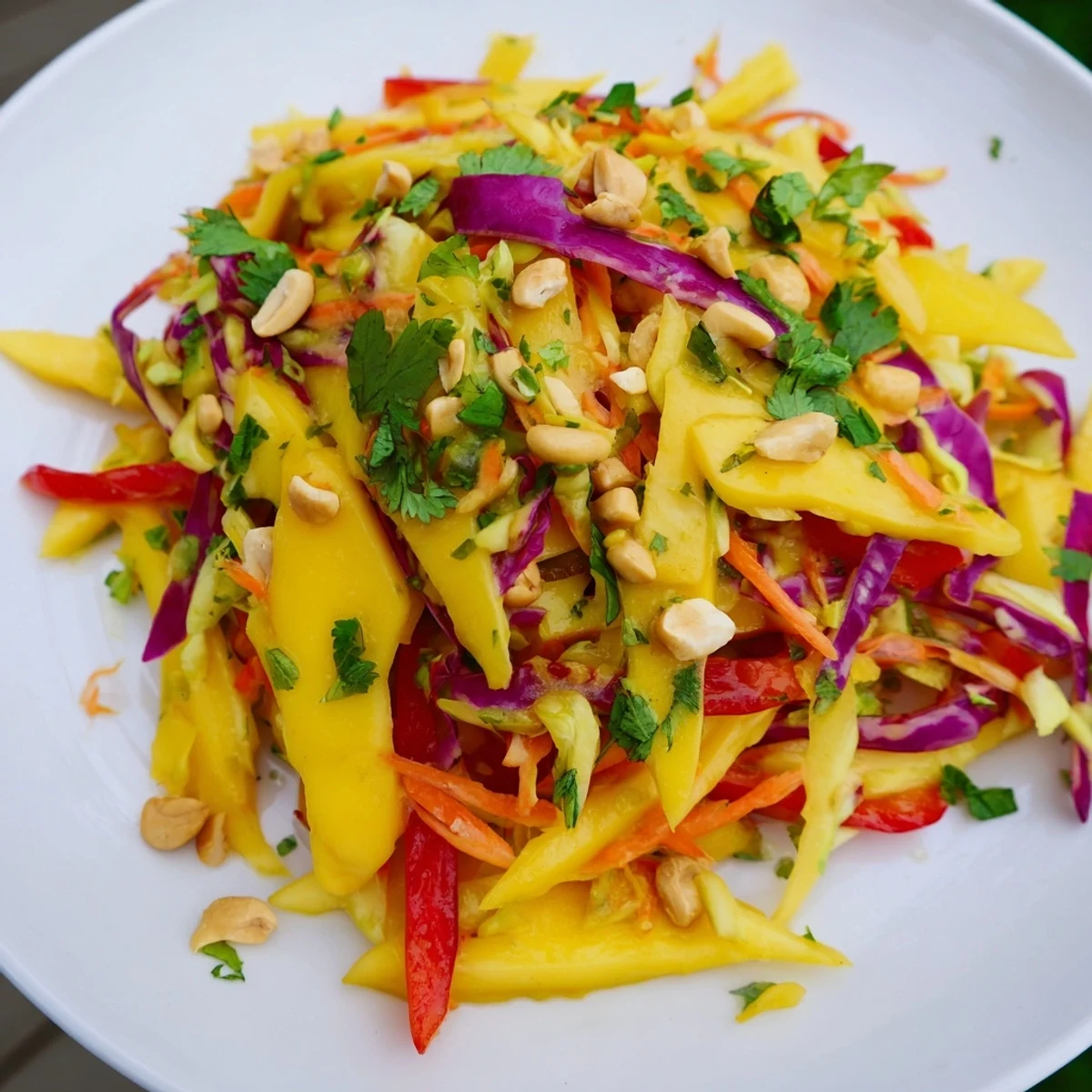 Colorful mango slaw with crisp red cabbage and carrots in a tangy lime dressing