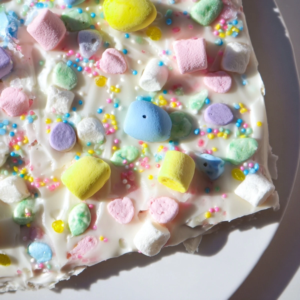 Homemade Easter marshmallow bark swirled with melted white chocolate and pastel mini marshmallows