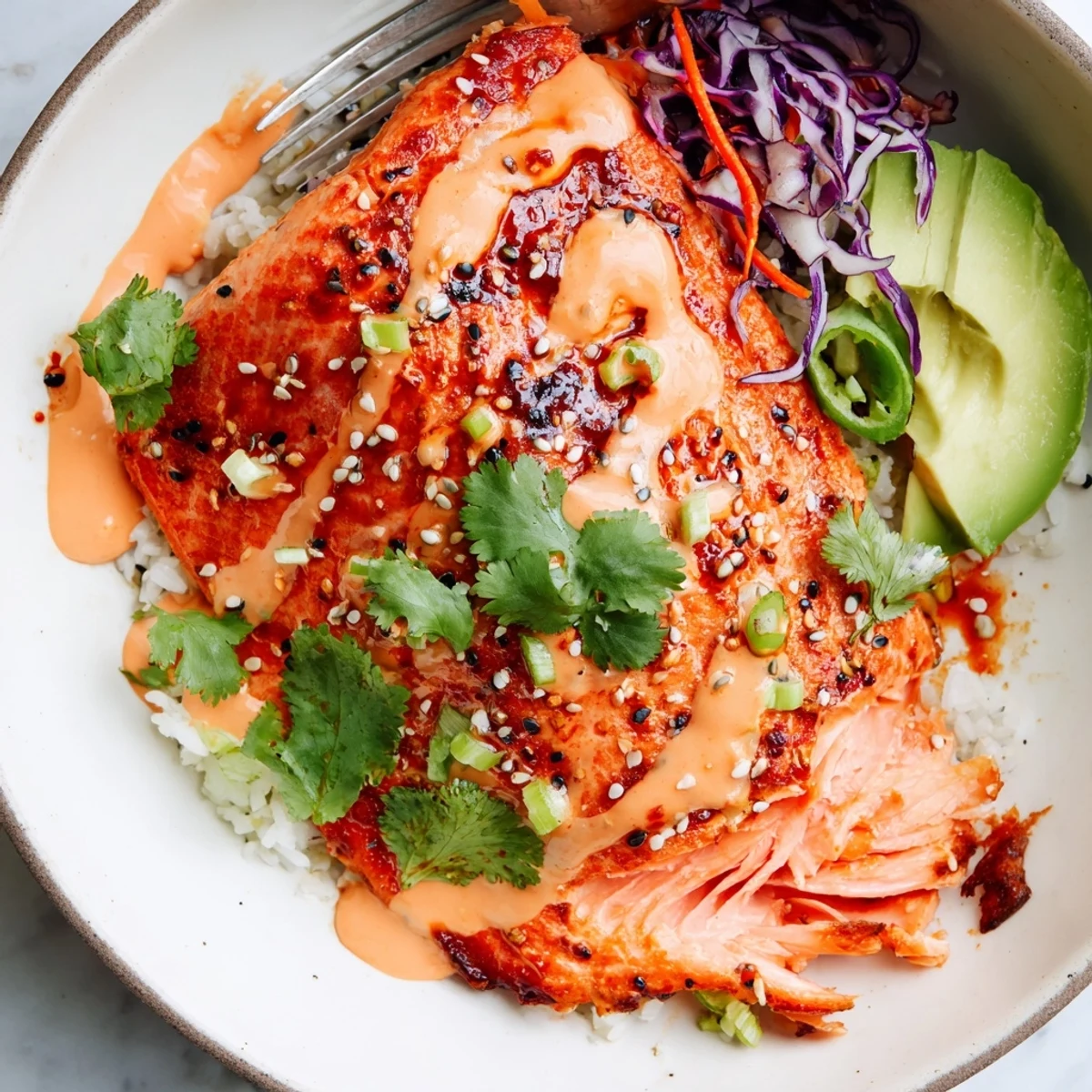 Serving suggestion: Bang Bang Salmon Bowls layered with shredded cabbage, sesame seeds