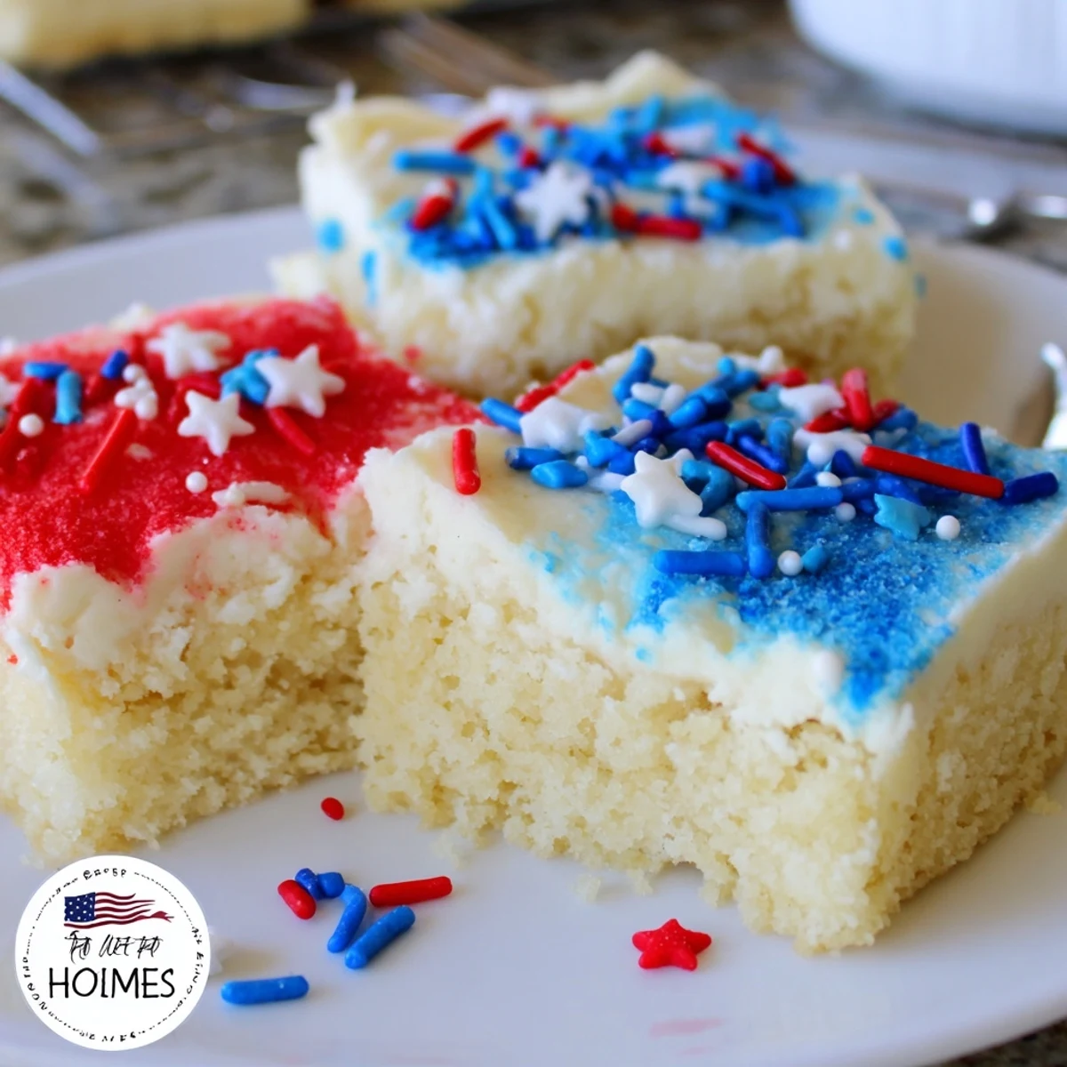 Patriotic Sugar Cookie Bars topped with swirled red, white, blue frosting  