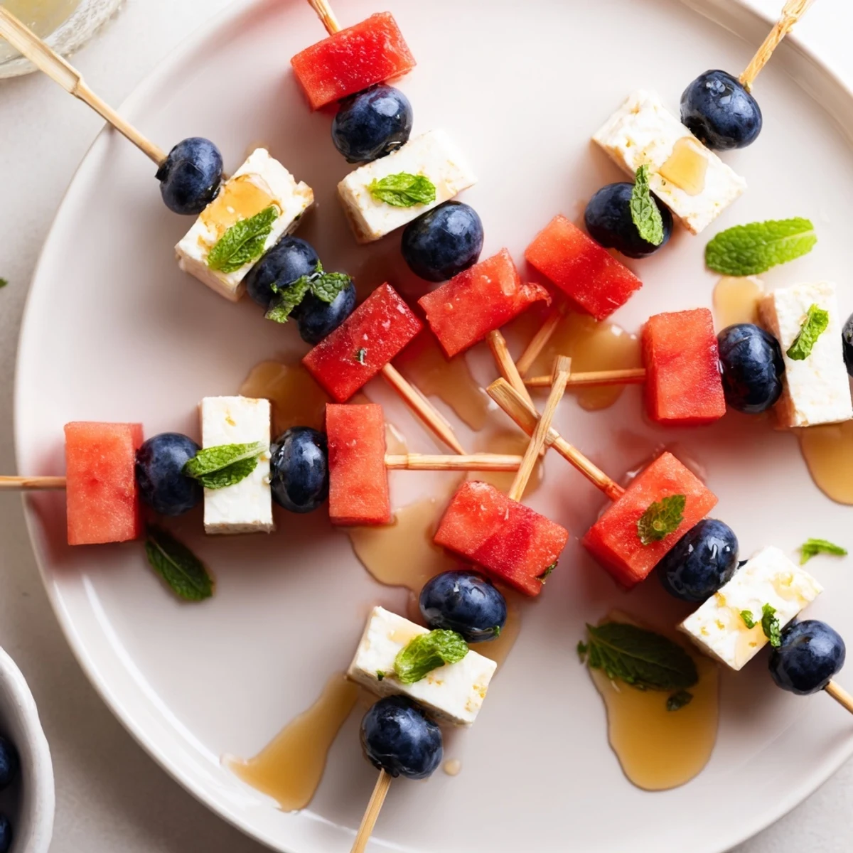 Patriotic Watermelon Feta Skewers arranged on platter, juicy watermelon and creamy feta