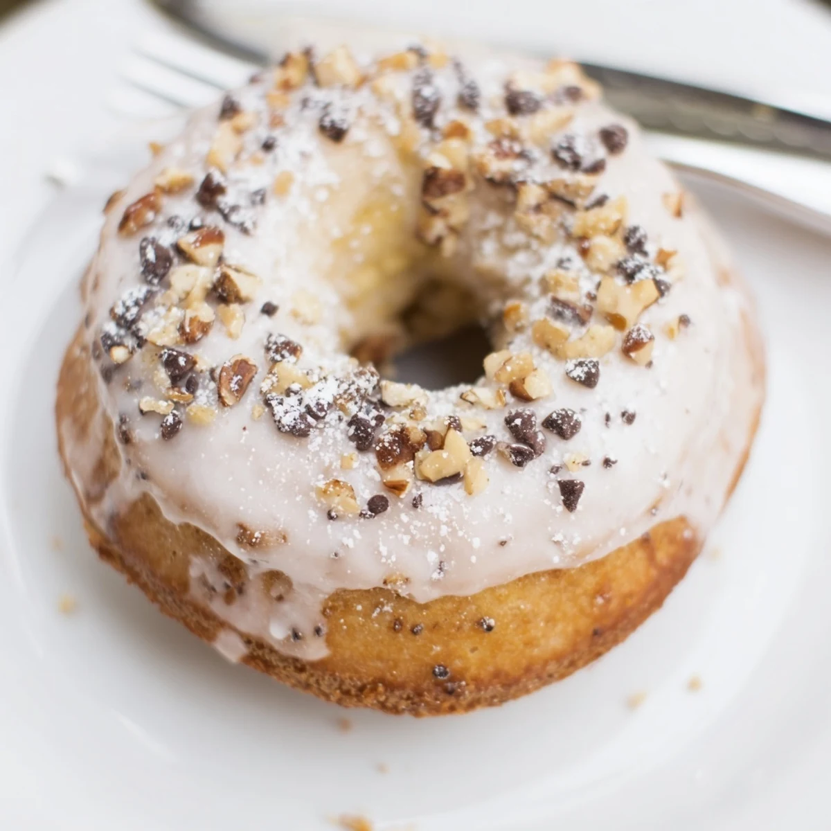 Light, fluffy Banana Donuts drizzled in vanilla glaze, ready for sharing