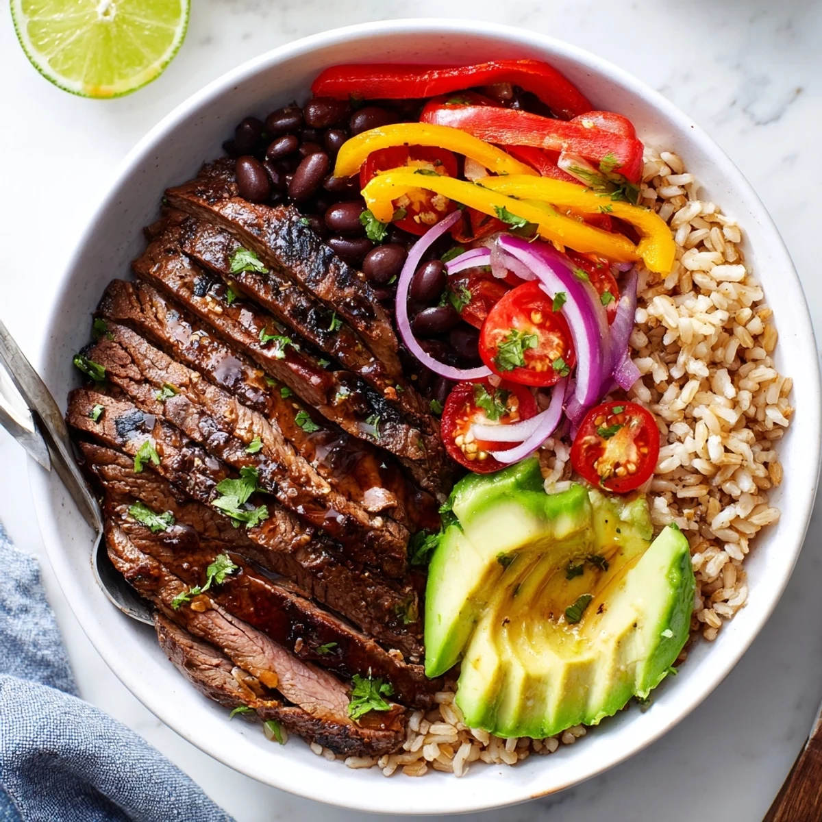 Charred bell pepper aroma, zesty lime and cilantro brighten Steak Fajita Power Bowls.
