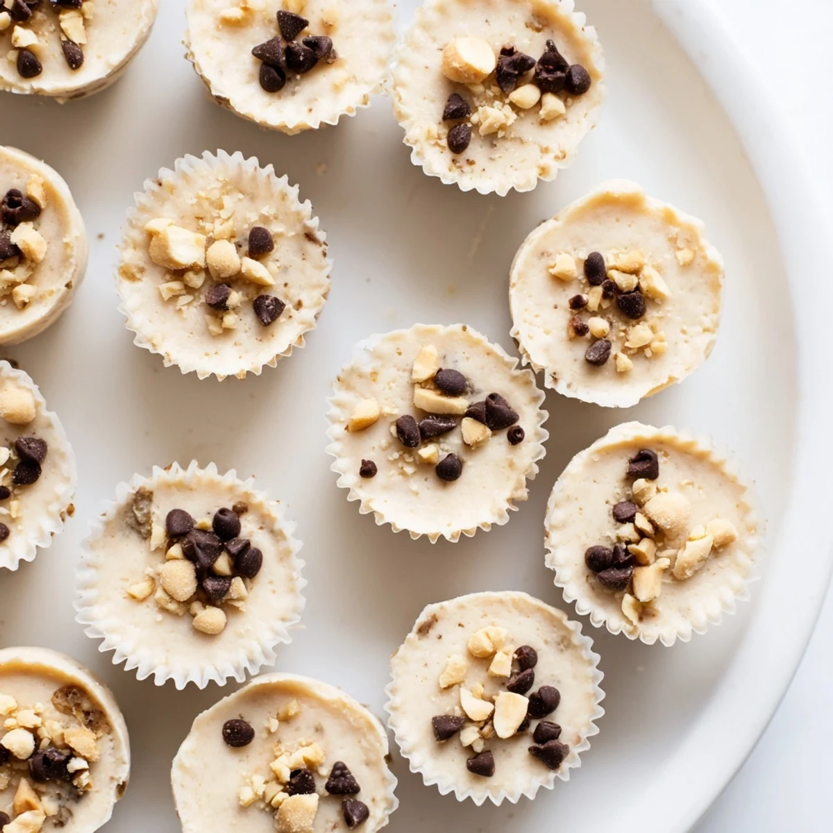 Scoopable peanut butter Greek yogurt bite with smooth texture and golden peanut butter swirls ready for freezing