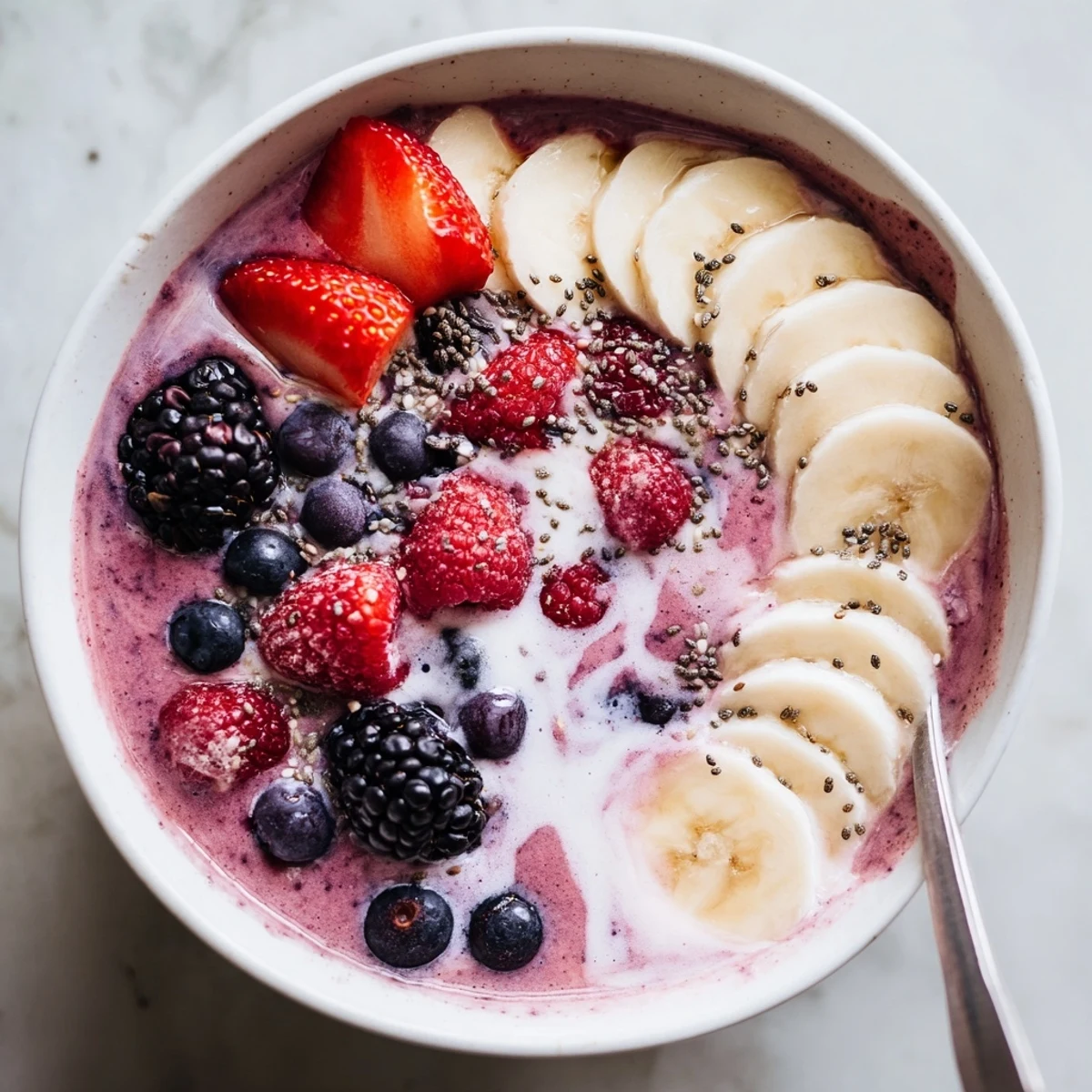 Chilled Summer Berry Smoothie with banana and almond milk, served morning