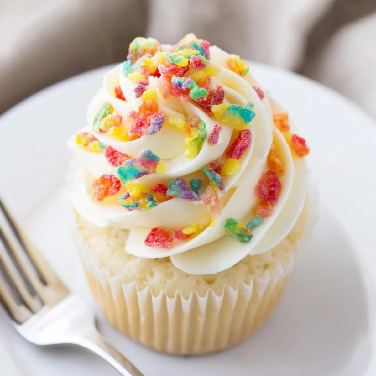 Sweet, airy Fruity Pebbles Cereal Frosting ready to decorate cakes or cookies